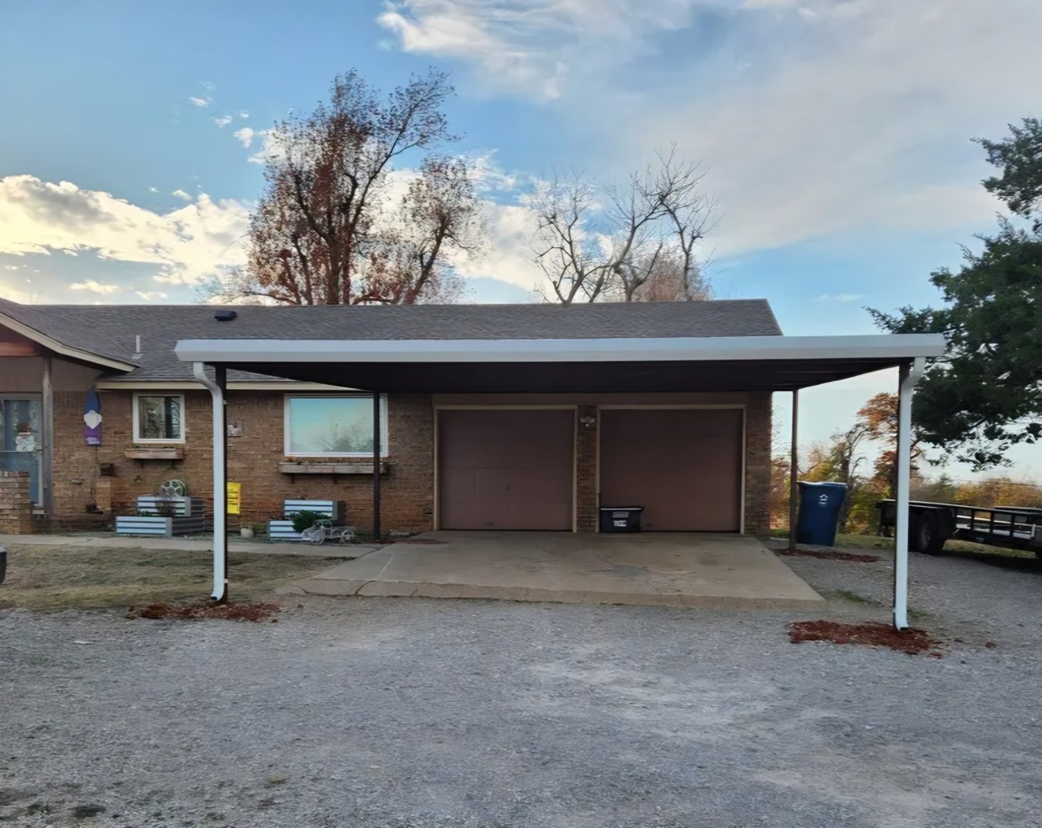 Attached steel carport